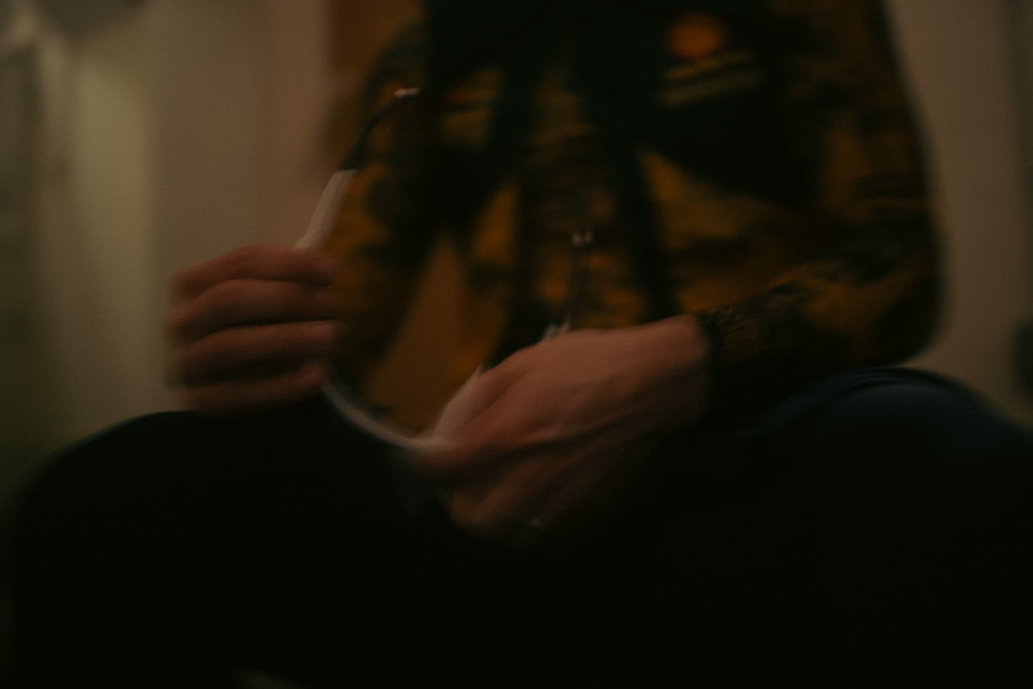 Hands zipping up jersey, motion blur close-up